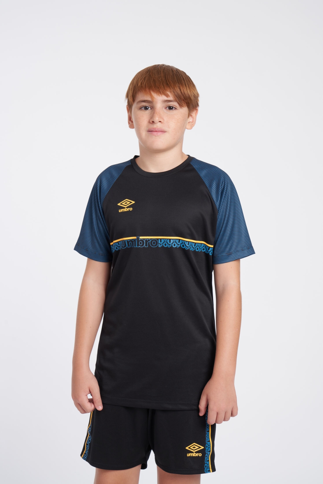 CAMISETA UMBRO SPIRITO JERSEY  JNR BLACK / ORANGE POP / PETROL BLUE