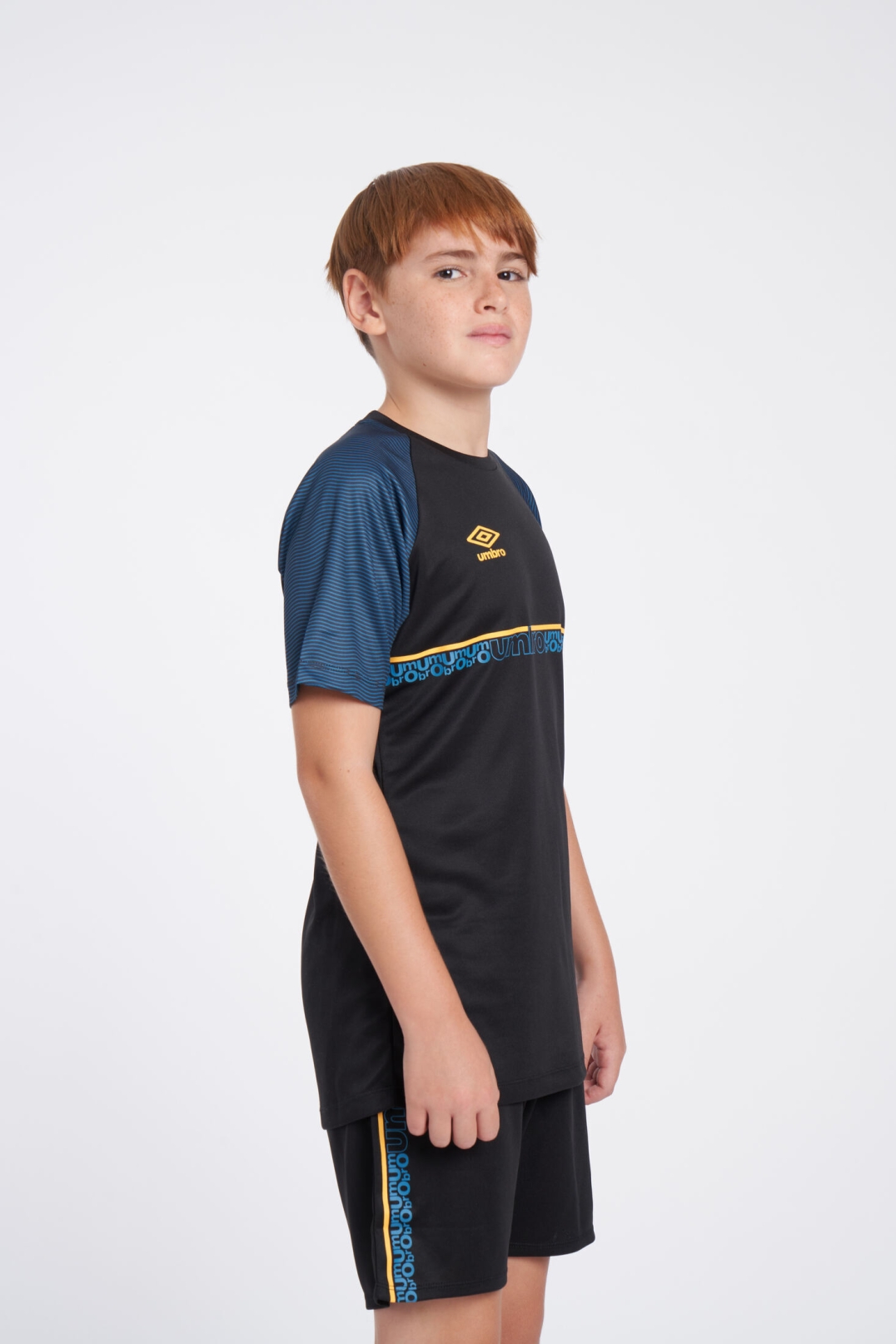 CAMISETA UMBRO SPIRITO JERSEY  JNR BLACK / ORANGE POP / PETROL BLUE