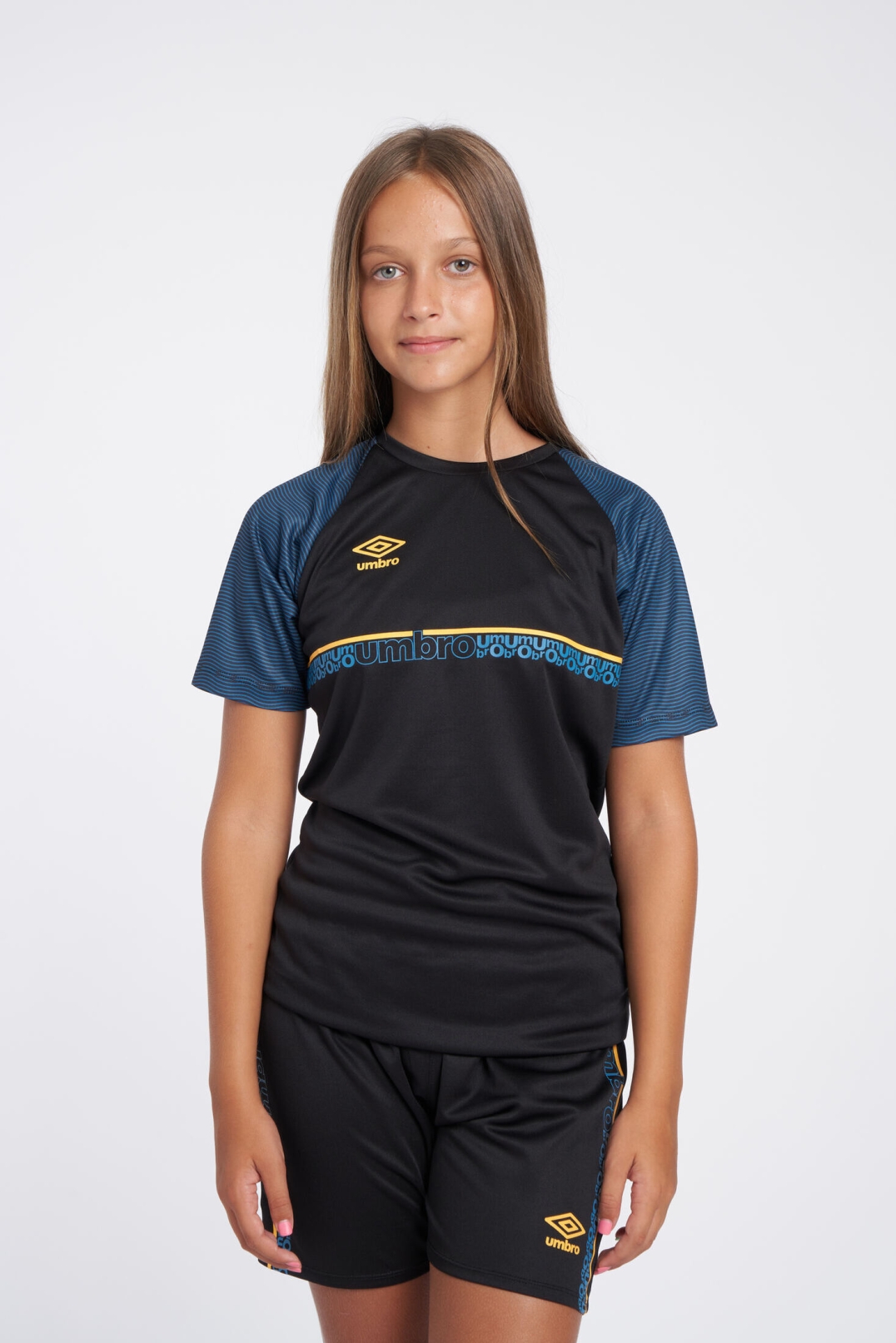 CAMISETA UMBRO SPIRITO JERSEY  JNR BLACK / ORANGE POP / PETROL BLUE