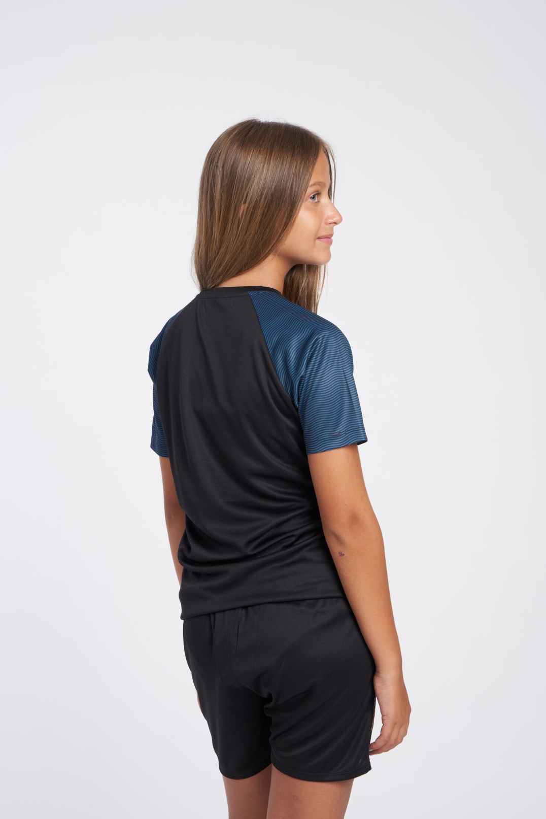 CAMISETA UMBRO SPIRITO JERSEY  JNR BLACK / ORANGE POP / PETROL BLUE