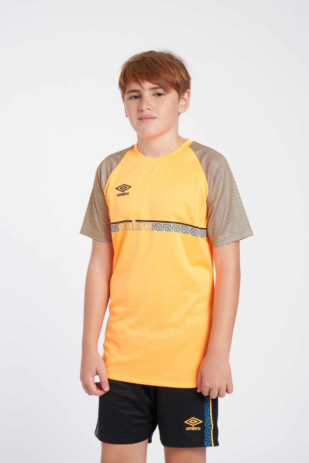 CAMISETA UMBRO SPIRITO JERSEY  JNR ORANGE POP / BLACK / PETROL BLUE