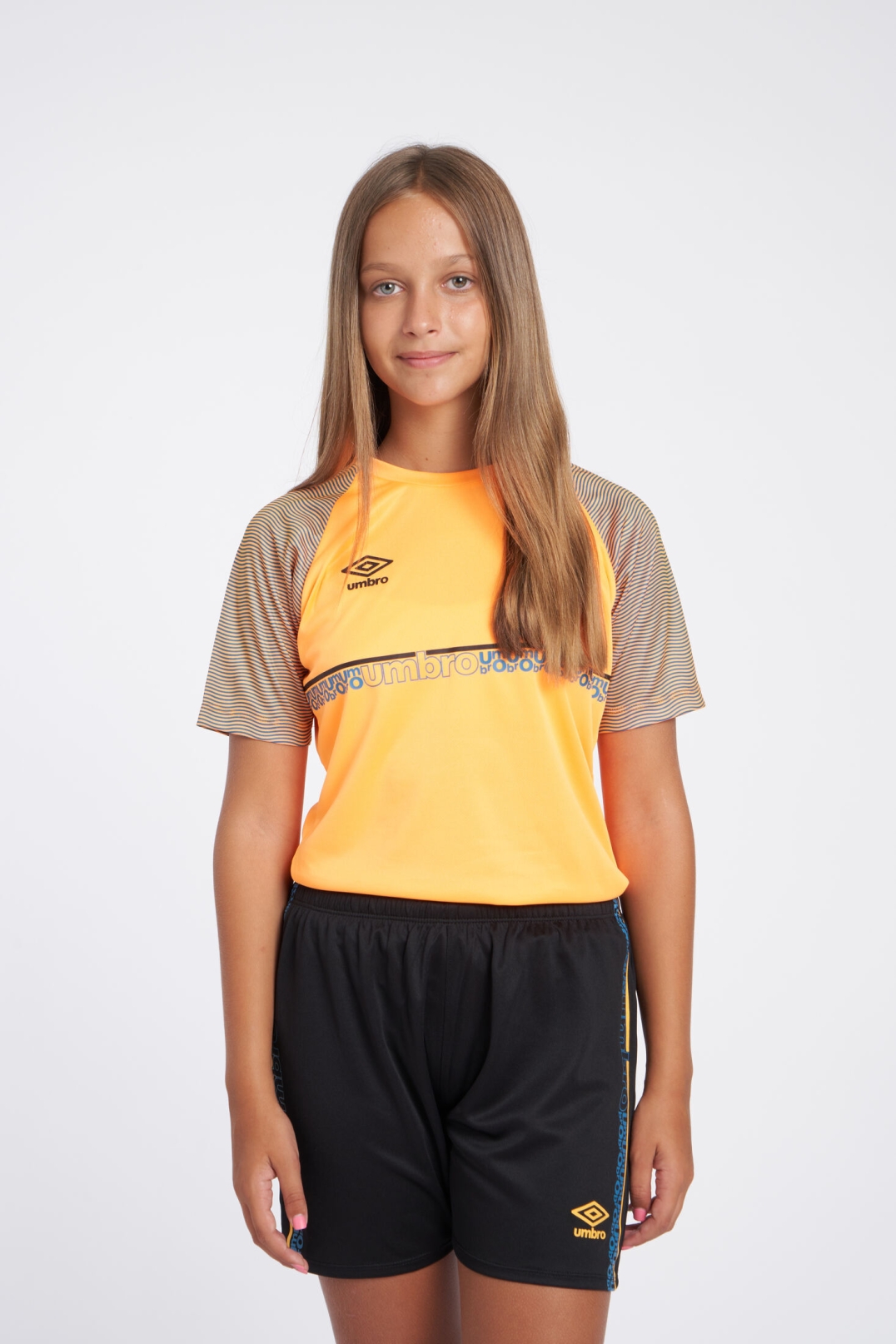 CAMISETA UMBRO SPIRITO JERSEY  JNR ORANGE POP / BLACK / PETROL BLUE